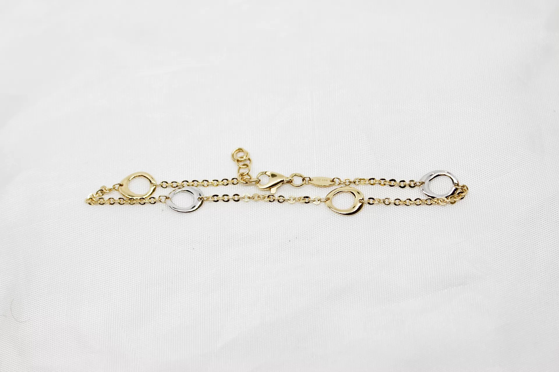 Pulseira em ouro bicolor com argolas
