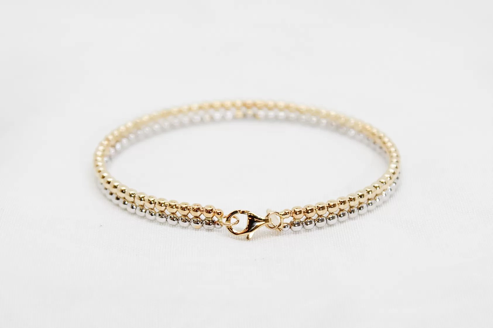 Pulseira em ouro bicolor escrava às bolinhas