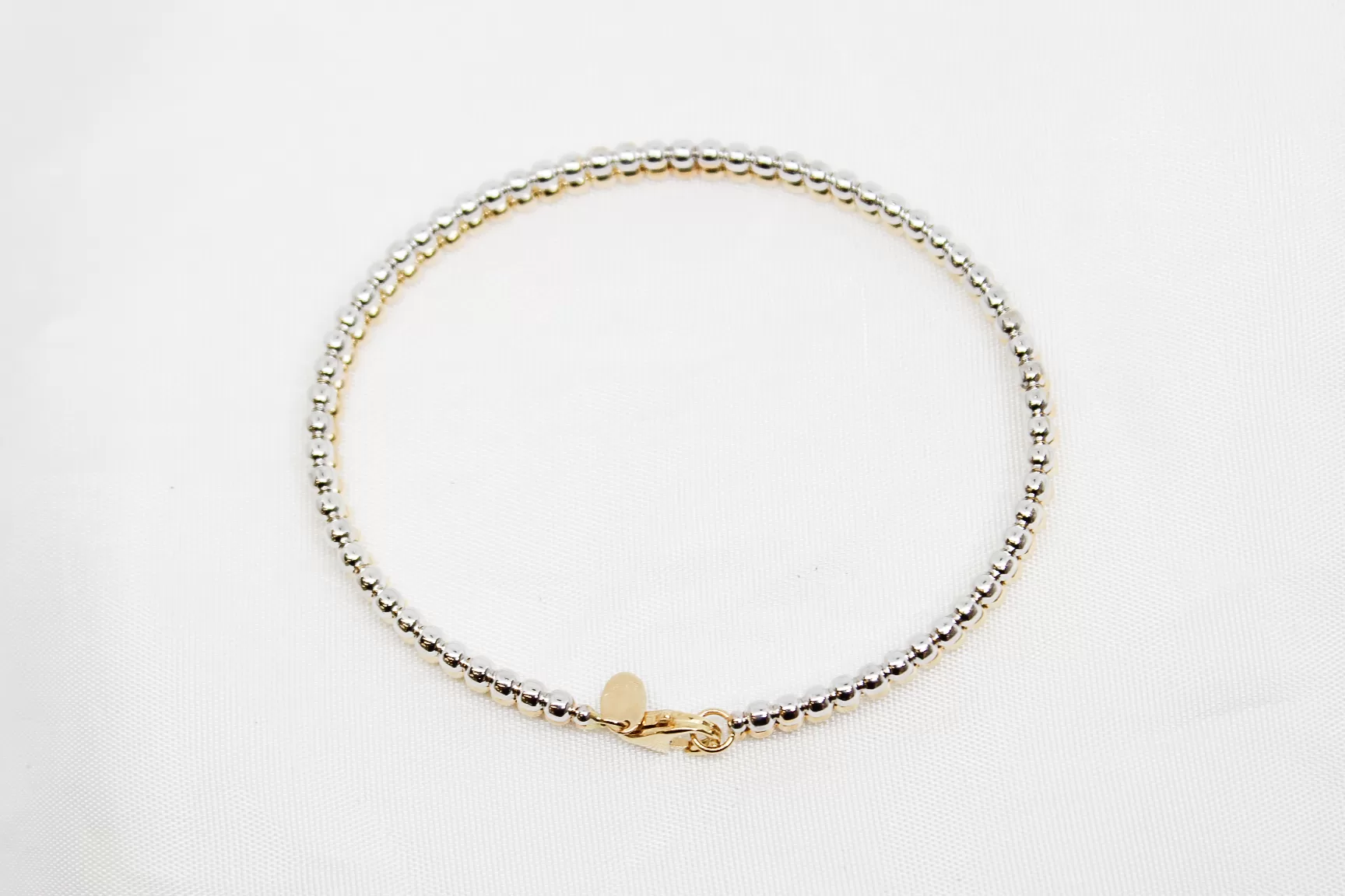 Pulseira em ouro bicolor escrava às bolinhas